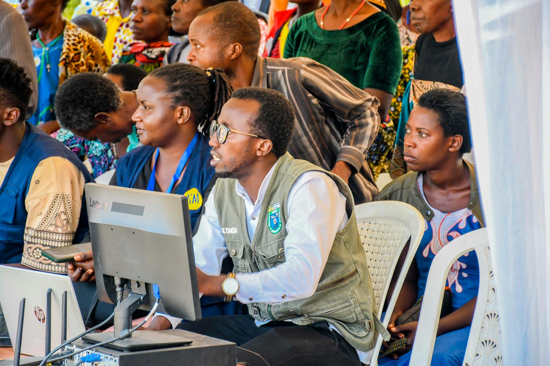 community gathering with technology in rwanda